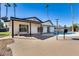 Well-kept backyard featuring a pool, a covered patio area, and clean exterior of the home at 1716 W Butler Dr, Phoenix, AZ 85021