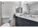 Bathroom featuring vanity with dual sinks and framed mirrors at 1716 W Butler Dr, Phoenix, AZ 85021