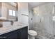 Bathroom featuring glass shower and vanity with marble countertop at 1716 W Butler Dr, Phoenix, AZ 85021