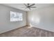 Bright bedroom features neutral tones and ceiling fan at 1716 W Butler Dr, Phoenix, AZ 85021