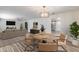 Open concept dining room features modern lighting, wood floors, and stylish seating at 1716 W Butler Dr, Phoenix, AZ 85021