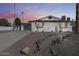Charming home exterior showcasing its well-maintained yard with rock bed, white brick and a spacious driveway at 1716 W Butler Dr, Phoenix, AZ 85021