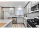Spacious kitchen with stainless steel appliances and ample countertop space at 1716 W Butler Dr, Phoenix, AZ 85021