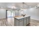 Open kitchen with a center island and sliding doors to the backyard at 1716 W Butler Dr, Phoenix, AZ 85021