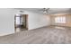Inviting living room with plush carpet, recessed lighting, and view to a brick-accented room at 1716 W Butler Dr, Phoenix, AZ 85021