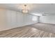 Open-concept living space with hardwood floors and plush carpet at 1716 W Butler Dr, Phoenix, AZ 85021