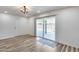 Bright living room with wood floors and sliding glass door access to the pool at 1716 W Butler Dr, Phoenix, AZ 85021