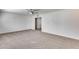 Large living room with neutral carpet, ceiling fan, and an open floor plan at 1716 W Butler Dr, Phoenix, AZ 85021