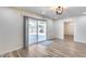 Bright living room with sliding glass doors to the backyard and hardwood floors at 1716 W Butler Dr, Phoenix, AZ 85021