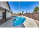 Beautiful backyard pool area with well-maintained landscaping, a covered patio, and privacy fencing at 1716 W Butler Dr, Phoenix, AZ 85021