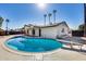 Stunning backyard pool with diving board and surrounding desert landscaping providing ultimate relaxation at 1716 W Butler Dr, Phoenix, AZ 85021