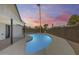 Backyard view of the pool showcasing the home's covered patio, and outdoor space at 1716 W Butler Dr, Phoenix, AZ 85021