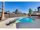 Beautiful backyard pool with diving board, privacy fence and plenty of room to relax and enjoy the backyard at 1716 W Butler Dr, Phoenix, AZ 85021