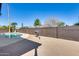 Backyard oasis with a refreshing pool, mature landscaping, and ample space for entertaining at 1716 W Butler Dr, Phoenix, AZ 85021