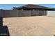 Spacious backyard with block wall, providing privacy and ample space for outdoor activities at 17683 W Odeum Ln, Goodyear, AZ 85338