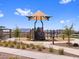 Community playground offers various play equipment including slides and climbing structures with walking path at 17683 W Odeum Ln, Goodyear, AZ 85338