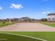 Sand volleyball court offers recreational opportunities in a well-maintained community park area at 17683 W Odeum Ln, Goodyear, AZ 85338