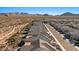 Panoramic aerial view of a residential neighborhood with mountain views in the distance at 18961 N 259Th Ave, Buckeye, AZ 85396