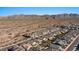 Aerial view of homes and desert landscape with mountains in the background at 18961 N 259Th Ave, Buckeye, AZ 85396