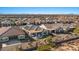 Aerial view of a home with a desert landscaped backyard, covered patio, and solar panels at 18961 N 259Th Ave, Buckeye, AZ 85396