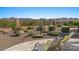 Lounge chairs overlook serene backyard with desert landscaping and mountain views at 18961 N 259Th Ave, Buckeye, AZ 85396