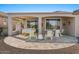Inviting outdoor patio featuring both lounge and dining furniture with scenic views of the grounds at 18961 N 259Th Ave, Buckeye, AZ 85396