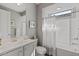 Neat bathroom featuring a combination tub and shower with a modern vanity and neutral color scheme at 18961 N 259Th Ave, Buckeye, AZ 85396