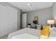 Well-lit bedroom featuring a dedicated desk area for a functional workspace at 18961 N 259Th Ave, Buckeye, AZ 85396