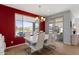 Contemporary dining room with backyard views and ample natural light at 18961 N 259Th Ave, Buckeye, AZ 85396