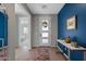 Bright entryway with hardwood floors and colorful decor leading to the various rooms at 18961 N 259Th Ave, Buckeye, AZ 85396