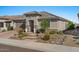 Inviting desert landscaping and brick pavers lead up to this lovely single-Gathering home at 18961 N 259Th Ave, Buckeye, AZ 85396