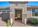 Covered porch with decorative columns, colorful furniture and beautiful desert plants at 18961 N 259Th Ave, Buckeye, AZ 85396