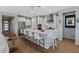 Spacious kitchen with white cabinets, stainless steel appliances, and a large center island at 18961 N 259Th Ave, Buckeye, AZ 85396