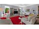 Bright living room with white couches and a large window with greenery views at 18961 N 259Th Ave, Buckeye, AZ 85396