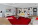 Bright living space with white couches that opens up into the white kitchen at 18961 N 259Th Ave, Buckeye, AZ 85396