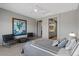 Serene bedroom with neutral tones, plush carpeting, and ensuite bathroom access at 18961 N 259Th Ave, Buckeye, AZ 85396