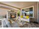 Cozy outdoor living area with fireplace and comfortable patio furniture setup at 18961 N 259Th Ave, Buckeye, AZ 85396