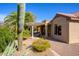 Tranquil backyard with a covered patio and desert landscaping elements at 19824 N Valencia Ct, Surprise, AZ 85374