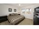 Bedroom with window, carpet, and TV on dresser at 19824 N Valencia Ct, Surprise, AZ 85374