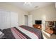 Neutral bedroom with ceiling fan, and sliding closet doors for ample storage space at 19824 N Valencia Ct, Surprise, AZ 85374