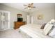 Serene bedroom with dresser, queen bed, and neutral color scheme at 19824 N Valencia Ct, Surprise, AZ 85374