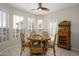 Cozy breakfast nook with a round table, seating for four, and bright windows at 19824 N Valencia Ct, Surprise, AZ 85374