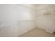 Walk-in closet with multiple shelves, lots of storage space, and clean carpeting at 19824 N Valencia Ct, Surprise, AZ 85374