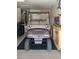 Spacious garage with a Columbia golf cart, workbench, and ample storage space at 19824 N Valencia Ct, Surprise, AZ 85374