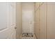 Hallway with closet, door to garage, and neutral tile flooring at 19824 N Valencia Ct, Surprise, AZ 85374