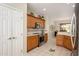 Kitchen showcases wooden cabinets, modern appliances, and tiled floors at 19824 N Valencia Ct, Surprise, AZ 85374