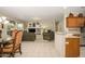 Inviting living room featuring tile floors, comfortable seating, and decorative shelving at 19824 N Valencia Ct, Surprise, AZ 85374