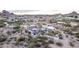 Desert home with solar panels and perimeter wall, surrounded by natural landscape at 2107 N Campo Allegre Dr, Tempe, AZ 85288