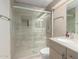 Modern bathroom featuring walk-in shower with glass door, sleek sink, and neutral color palette at 2107 N Campo Allegre Dr, Tempe, AZ 85288