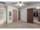 Bright bedroom featuring a closet and a door to a bathroom at 2107 N Campo Allegre Dr, Tempe, AZ 85288